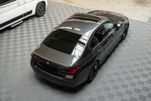 allgallery 39 a black car parked in a garage